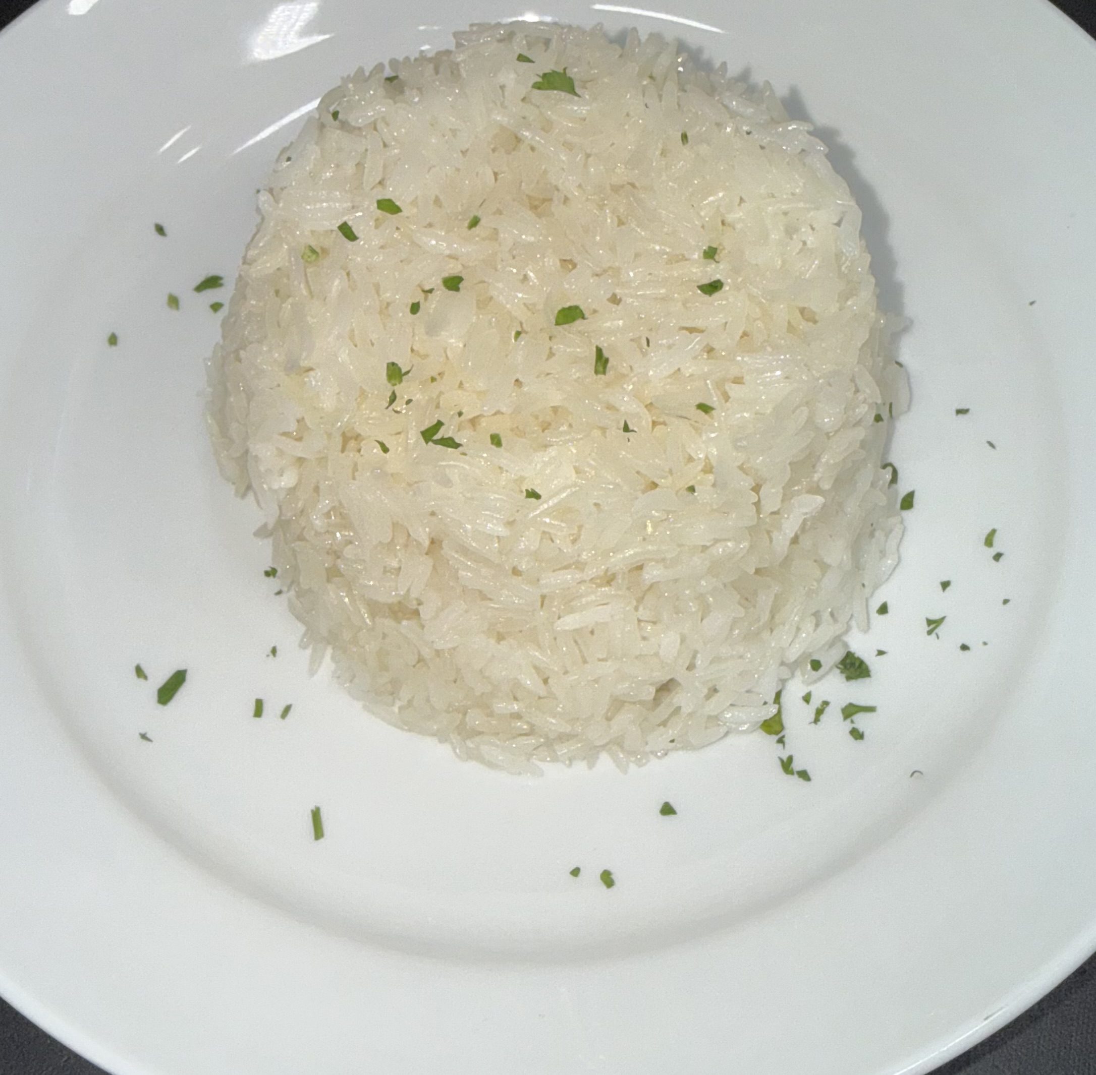 Molded steamed white rice with parsley