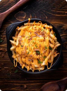 Cheesy fries with bacon and herbs.